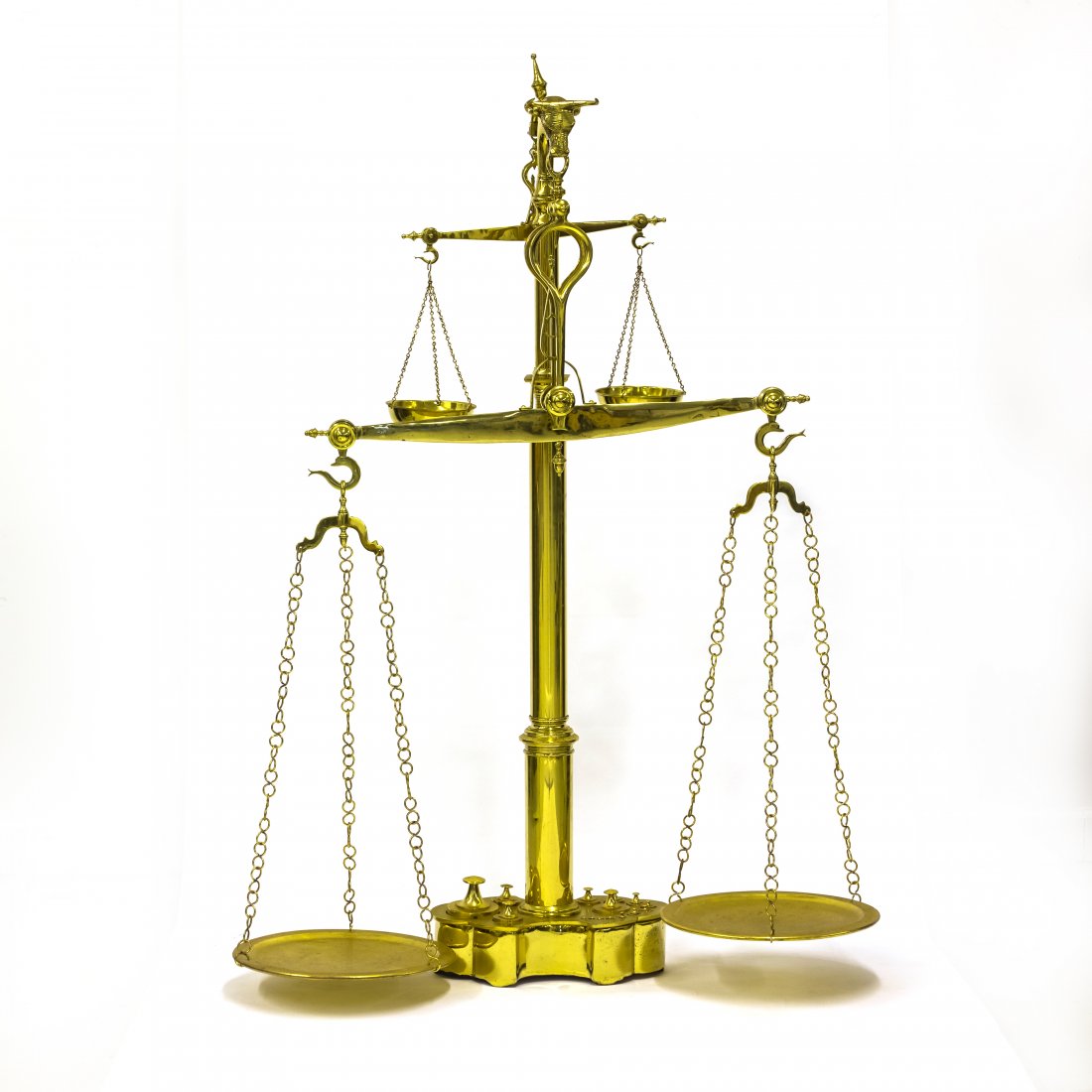 LARGE Brass Two Beam Butchers Meat Scale w Weights: Large solid brass butchers scale with bull head figural final and 15 cylinder weights. Scale features four round brass weighing platforms hanging from chains. Approximate height: 50 in. x 30 in. x 15 