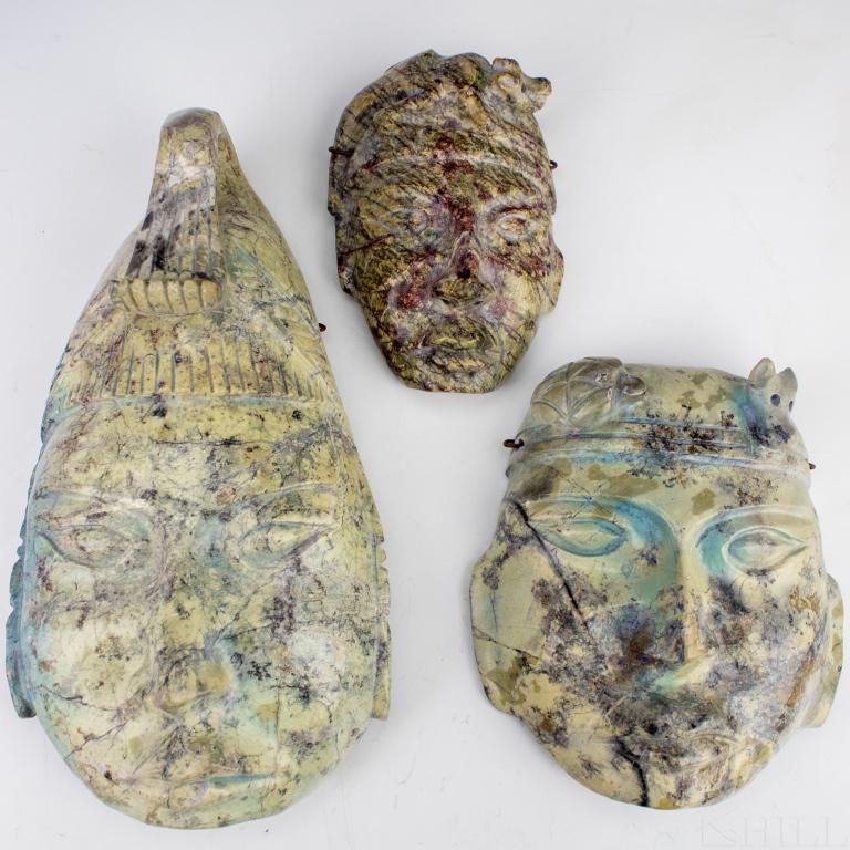 3 VTG Central American Carved Tribal Stone Masks: Vintage carved stone masks. Features a series of tribal, Aztec, Incan, or Mayan forms carved from a light green stone. Measures 6" x 4", 6 1/2" x 6", and 10 1/2" x 6". Good overall condition with mino
