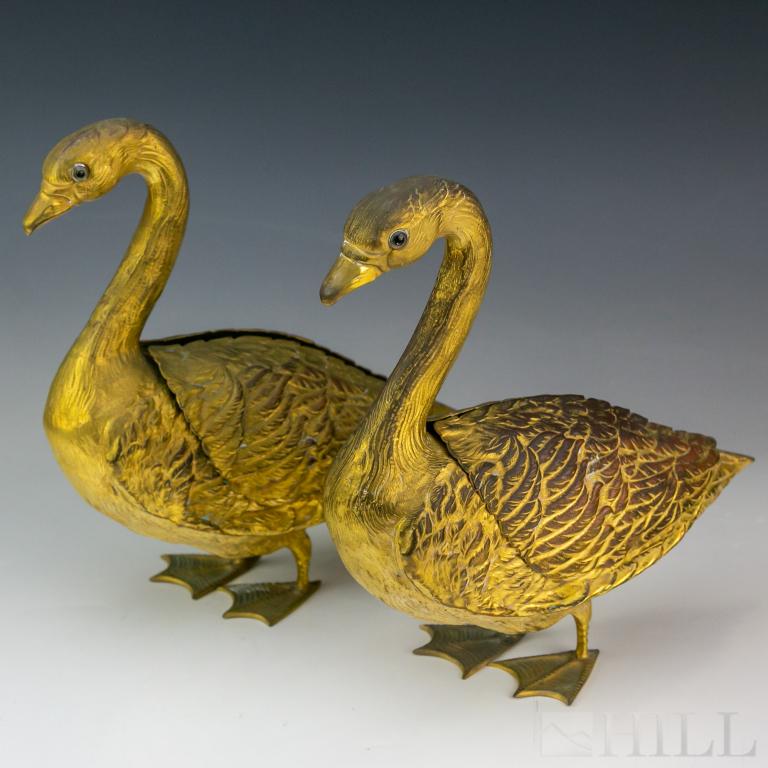 Pair Antique French Dore Bronze Goose Swan Vases: Crafted of bronze with gold gilt finish. Swan or goose form garniture or centerpiece set with folding wings. Wings open to expose fitted planter or flower frog inserts. Heads set with glass eyes. Each