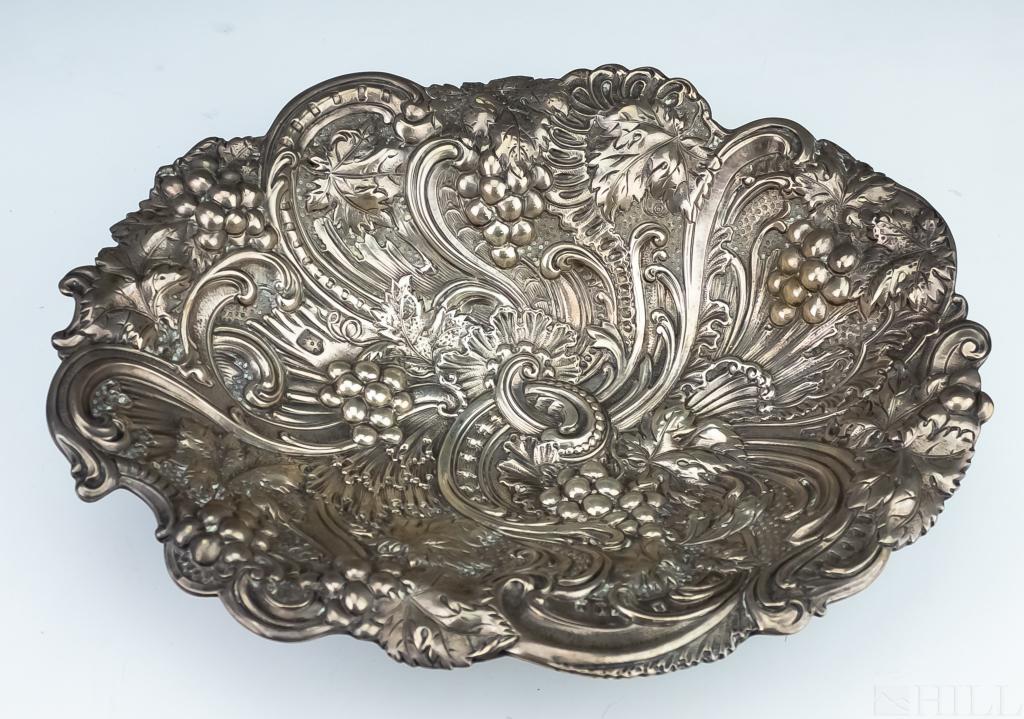 Gorham Sterling Silver Repousse Footed Centerpiece: Rare Gorham sterling silver centerpiece bowl. Features elaborate high relief baroque repousse with scrolls and grapes with foliate embellishments. Marked on rim with Gorham mark, Sterling, 3260A. Meas