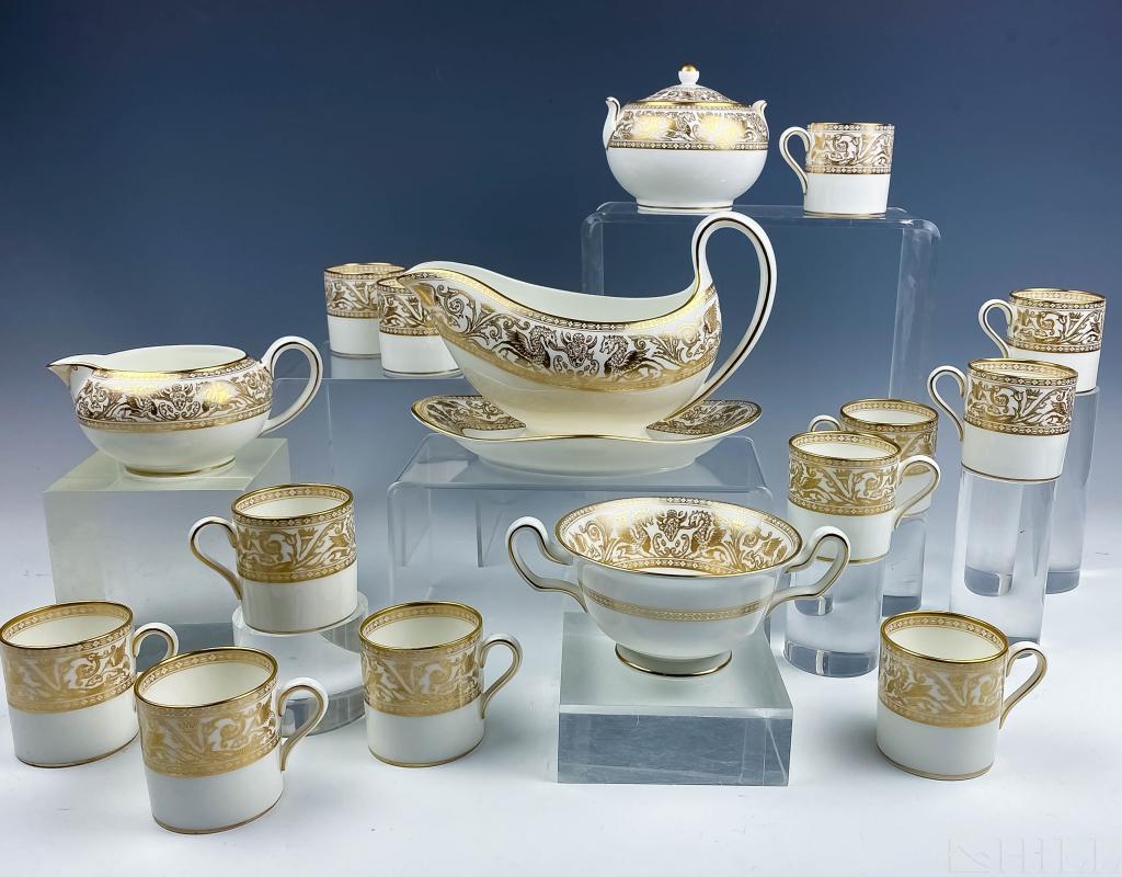 127 Pcs Wedgwood Gold Florentine English China Set: Set of 127 pieces of Wedgwood fine gold Florentine English bone china tableware. Features (1) 10" x 7 1/2" vegetable serving bowl, (24) 10 5/8" dinner plates, (1) 15" oval platter, (12) 8" soup bowls,