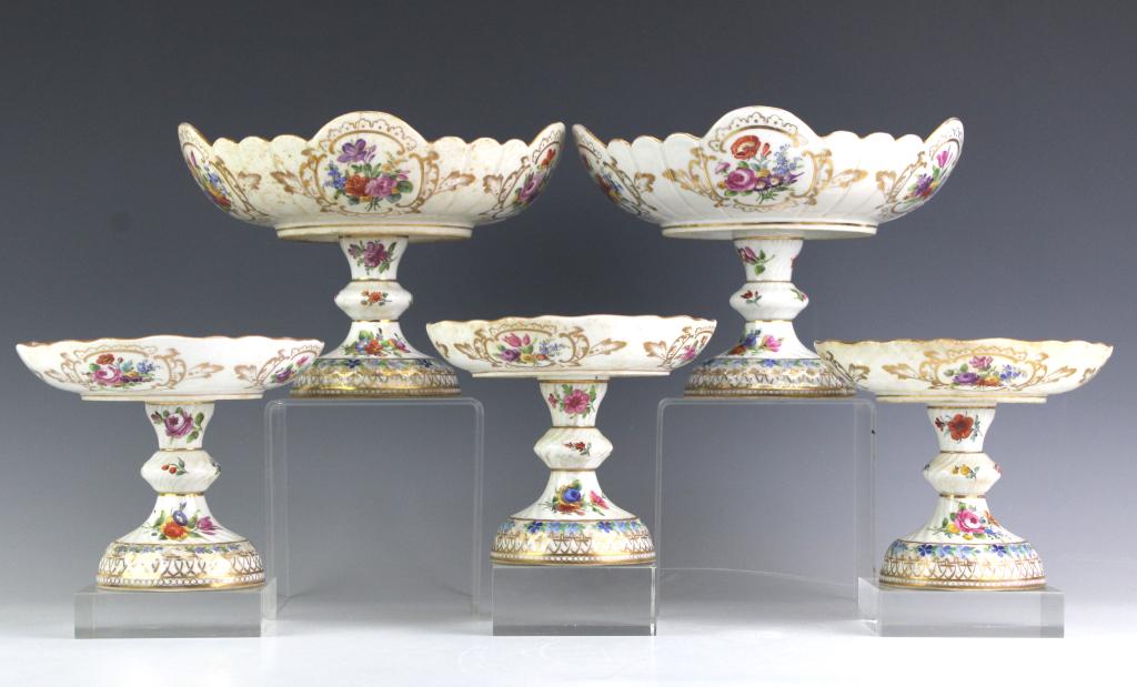 Lot 5 KPM Berlin Porcelain Footed Floral Compotes: Set of five antique signed KPM (Konigliche Porzellan Manufaktur) Berlin porcelain footed compote dishes. Features hand painted spring floral designs with ornate gold gilt basket weave borders. Each is