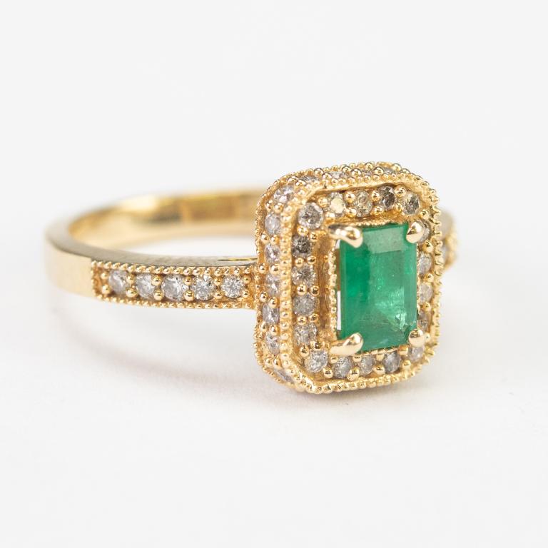 Ladies Designer Signed 14k Diamond & Emerald Ring: Ladies designer signed diamond and emerald gemstone ring. Features a prong set green emerald with a halo of round cut diamonds. Features approximately 1/2 carat of diamonds and 1/2 carat emerald. With