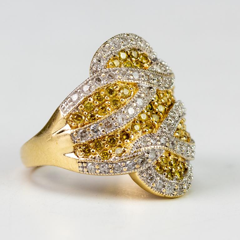 Designer Signed 14k Two Tone Yellow Diamond Ring: Ladies designer signed two tone gold and two tone diamond ring. Features a swirl of pave set yellow and white round cut diamonds. Total diamond weight is approximately 1 carats. Marked 14k with makers