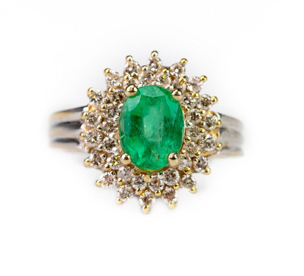 Vintage Emerald & Diamond 14k White Gold Ring: Vintage emerald and diamond gemstone ring. Features a 1.5 carat oval emerald surrounded by two rows of round cut prong set diamonds with an approximate combined weight of 1/3 carats. Marked 14k RY, si