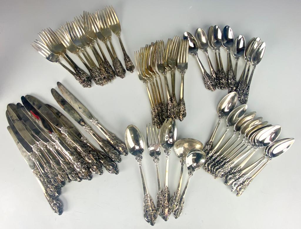 Service 12 Godinger Baroque Silver Plated Flatware: Godinger silver plated flatware service for 12. Features 12 each of the following: dinner knives, place spoons, teaspoons, and salad forks. Also 11 dinner forks, and 5 serving pieces. Good overall con