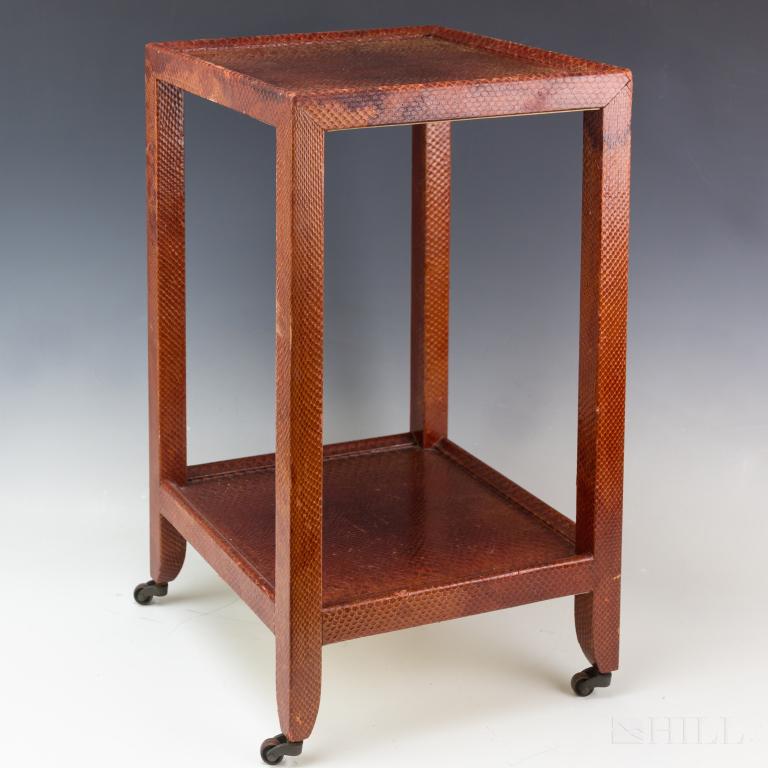 Snakeskin Telephone Table Attributed Karl Springer: Two tier style telephone table with castor wheels attributed to Karl Springer. Elegant vertical table covered in tan and black snakeskin. Provenance: $100,000,000 Palm Beach mansion. Table approximate