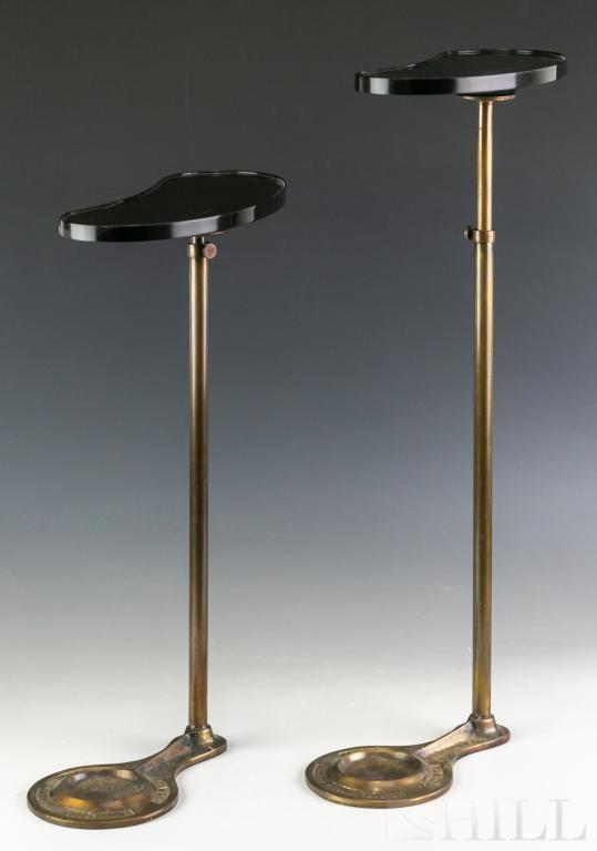 Pair Adjustable Brass Foot Mahogany Chesham Tables: Vintage pair of Chesham tables. Brass foot and adjustable height stem fitted with a mahogany finished wood table top. Intended to fit under the foot of a sofa or chair and provide a small surface for 