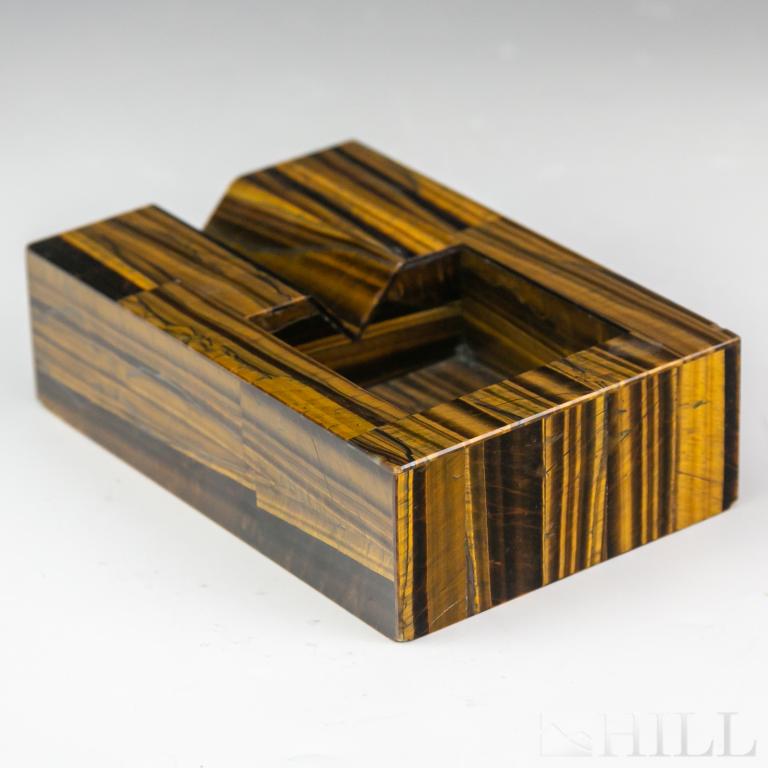 FINE Mid Century Italian Tigers Eye Cigar Ashtray: Crafted of Golden Tiger's Eye gemstone veneer. Simplistic clean line mid century modernist design. Measures approximately 6 1/2 in. x 4 1/4 in. x 1 7/8 in. Good condition with mild surface wear, small