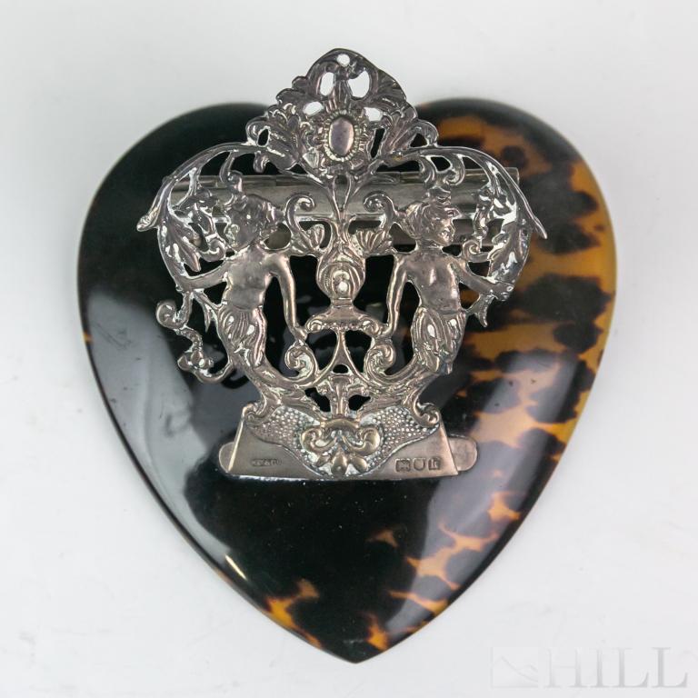 Ornate Edwardian Grey & Co Silver Desk Clip: English sterling silver desk paper clip. Features an ornate design with mermaid type of figures. Bears Grey & Co English silver hallmarks. Clip approximately 4 in. x 4 1/4 in. Good condition with mild