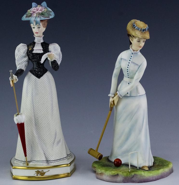 2 Royal Worcester China Bridget Elizabeth Statues: Pair of Royal Worcester figurines. Features the forms titled Bridget and Elizabeth. From the Victorian Series. Measures 8" and 8 3/4" tall. Good overall condition with no damage to note. Hill Auction 