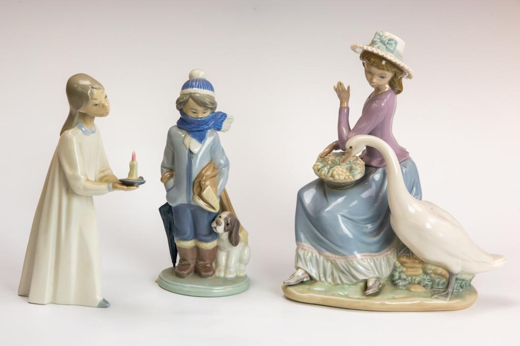 LOT 3 Lladro Retired Scarf Boy Candle Girl Goose: Lot of 3 retired Lladro figures. Includes "Winter" Boy With Scarf # 5220, Girl With Candle # 4868, and Girl with fruit and goose "Trying To Eat" # 5034. Girl with goose: 6 in. Girl with Candle: 8 in. 