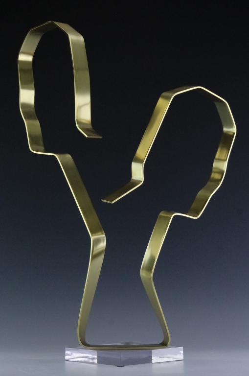 Dan Murphy 20c American Faces Modernist Sculpture: Signed original modernist sculpture by Dan Murphy (20c American) "Faces" depicts a pair of opposing silhouettes in gold anodized aluminum. Rests on a Lucite acrylic base. Artist signature, title and d