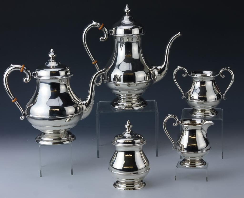 American Sterling Silver 5pcs Tea Coffee Set 1990g: Vintage American sterling silver five piece tea and Coffee set. Comes with a tea pot, coffee pot, lidded sugar bowl, waste bucket and creamer. All with bulbous bodies and scrolled handles. Measures 4