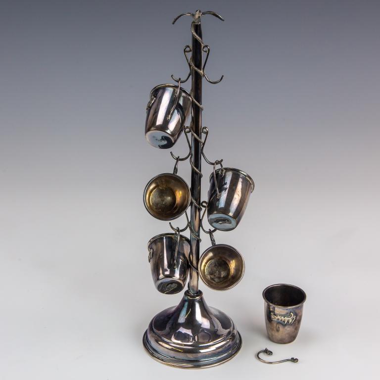 Sterling Silver Judaica LChaim Shot Glass Set 198g: Sterling silver Judaica shot glass and display stand set. Includes 6 cups marked 925 and 6 hook display stand with flying bird adorned at the top, marked 925 at rim. Cups. Raised Hebrew letters for "L