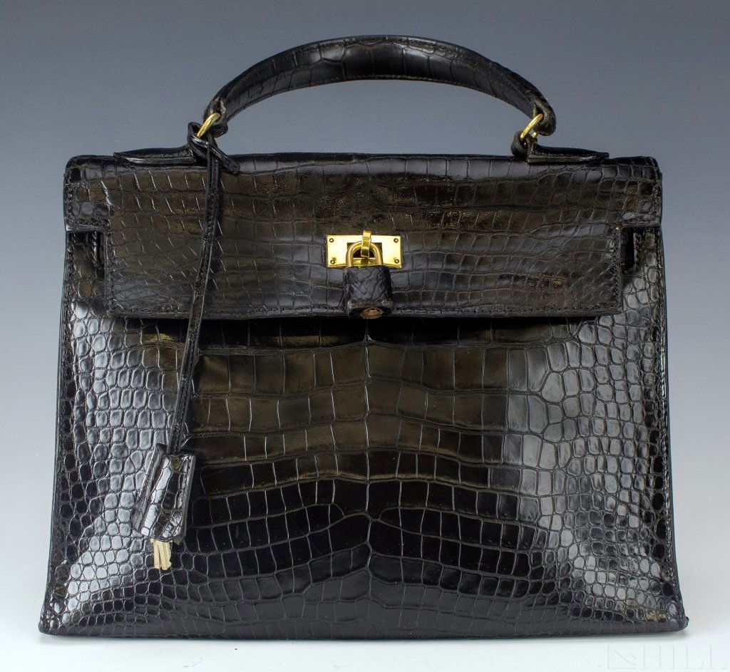 Hermes Birken Kelly Crocodile Handbag Circa 1964: Vintage Birken Kelly bag purse By Hermes, France. Features the classic design with this example in black crocodile skin leather. Comes with original lock and key. Signed Hermes. Measures 12 1/2\" x 10