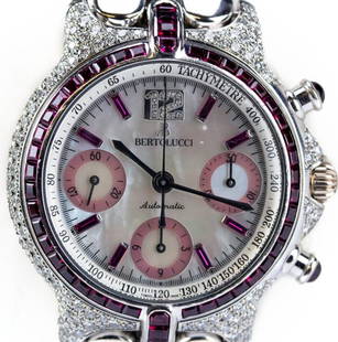 Bertolucci 18 White Gold Diamond Ruby Chrono Watch: Guaranteed Authentic Bertolucci chronograph wristwatch. Features an 18k white gold case and bracelet. The case decorated with pave set diamonds and rubies. The dial is mother of pearl with