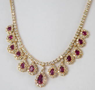 18k Gold 20 CTTW Diamond Ruby Dangle Drop Necklace: Ladies AGL certified diamond and ruby necklace in 18k gold. Features a graduating series of tear drop shaped pendants with crimson, pigeon blood red, well matched, rubies surrounded by bright white