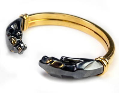 Cartier 18k Gold Panthere Hematite Bangle Bracelet: Guaranteed Authentic 18k bracelet with Panthere end pieces made out of hematite with gold eyes. 7cm outer width and 6cm inner dimensions of the bracelet. Signed Cartier. Stamped 750. 264349.