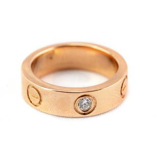 Cartier 18K Rose Gold & Diamond Love Ring Sz 4 1/2: Guaranteed Authentic Cartier French Love ring with diamond. Features the classic ring in rose gold with a .07 carat diamond in the center. Marked Cartier 750 49 OE9959 with French assay marks.