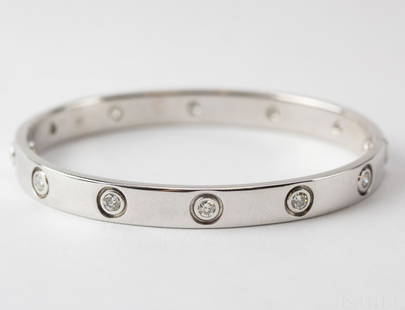 Cartier 18k White Gold 10 Diamond Love Bracelet 750-16: Guaranteed Authentic Cartier 18k white gold Love bracelet. Features 10 round cut diamonds set along this classic design. Total gemstone weight is approximately .96 carats. Inner measurement is