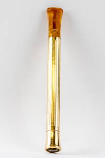 Cartier 14k Gold & Bakelite Cigarette Holder VTG: Guaranteed Authentic Cartier cigarette holder. Features a 14k gold sleeve with a caramel tone bakelite mouthpiece. Marked Cartier 14k Sleeve. Size 4 3/4". Weighs 15 grams. Good overall