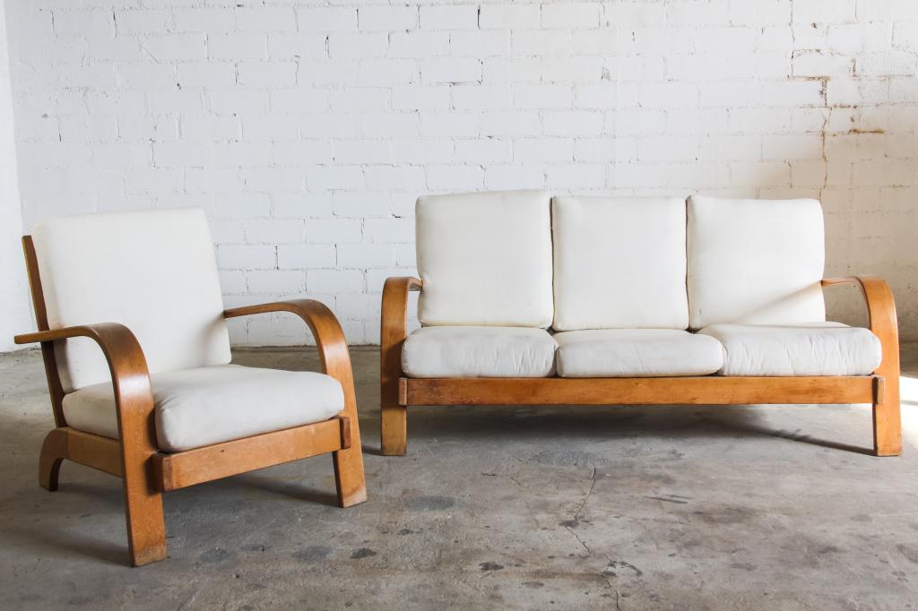 Russel Wright American Modern Sofa and Arm Chair: Vintage mid century modern sofa and arm club chair set designed by Russel Wright. Part of the American Modern line. Blond finished maple with white upholstered cushions. Streamline modern design 3 sea