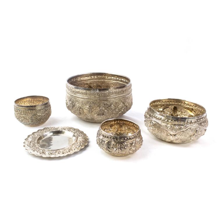 Repousse Sterling Silver Burmese Indian Asia Bowls: Collection of maker signed sterling silver bowls. Features highly decorated bowls measuring 2 1/4" x 3 1/4" up to 3 3/4" x 7". All marked on base with one coming with underplate. Weighs 646 grams. Goo