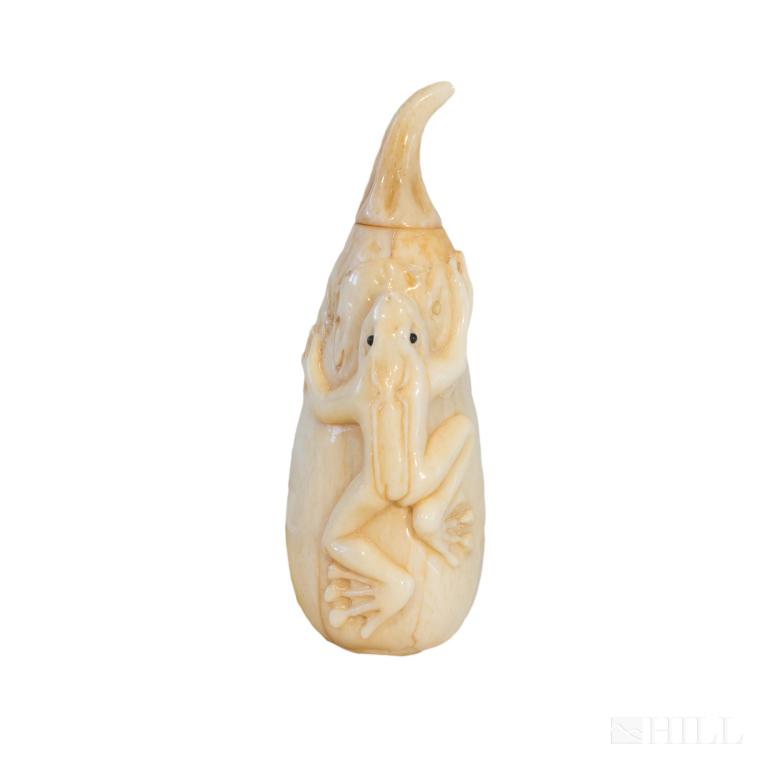 Asian Chinese Style Carved Bone Frog Snuff Bottle: Nicely carved snuff bottle in the form of a eggplant with tree frog crawling on it. Quality craftsmanship. Stem of eggplant twist off, featuring the snuff spoon. Measures 3 1/2 in. x 1 1/4 in. Made of