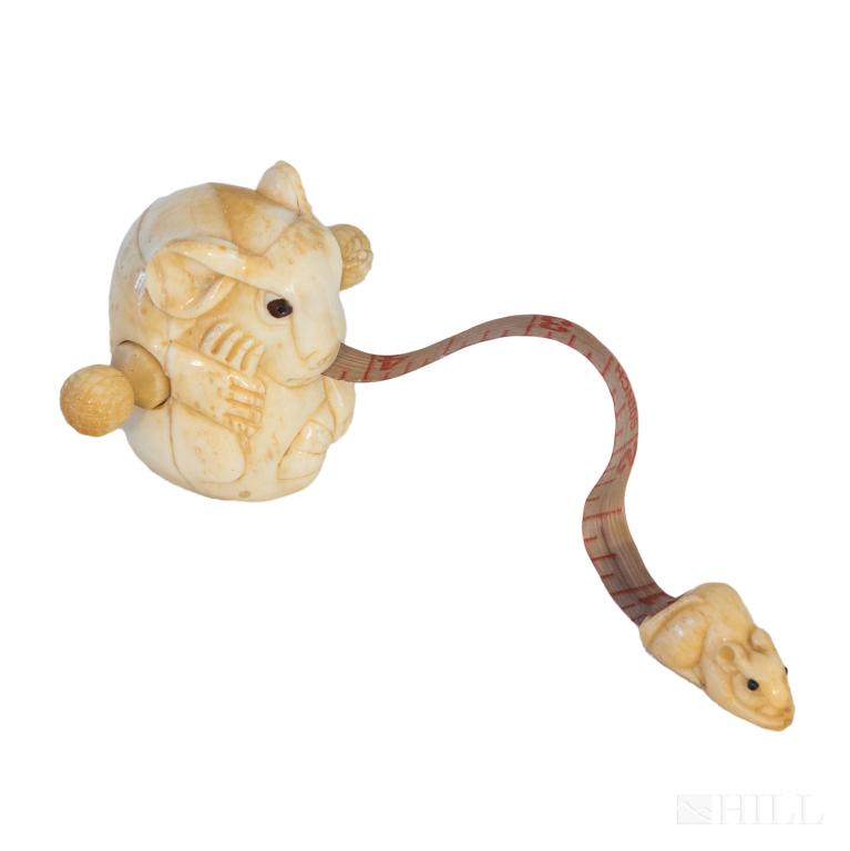 Carved Bone Rat and Mouse 60" Figural Tape Measure: Intricately carved figural tape measure in the form of a rat. Quality and detailed craftsmanship. Tape measures up to 60 in. with a mouse and rats tongue as the tape. Measures 2 in. x 2 1/2 in. x 2 1/