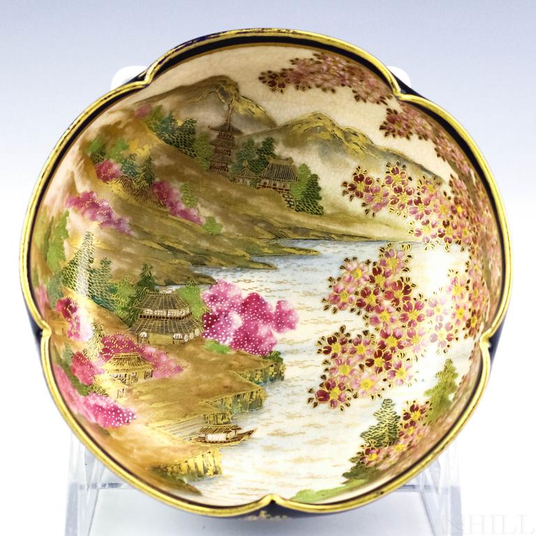 Japanese Meiji Period Satsuma Pottery Low Bowl: Antique 19th century Japanese Meiji period scenic landscape decorated bowl. Crafted of fine quality pottery with hand painted finish. Interior depicts a lakeside scenic landscape with mountains, build