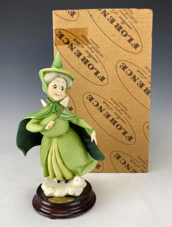 Giuseppe Armani Disney Fuana Fairy #609C with Box: Giuseppe Armani sculpture of Walt Disney's "Fauna" #0609/C. Artist Signed Giuseppe Armani. Depicts the flighty, green dressed fairy of the three Good Fairies from Sleeping Beauty. Approximate 7 1/2 in