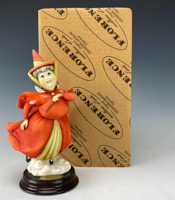Giuseppe Armani Disney Fairy Flora #0608C w/ Box: Giuseppe Armani sculpture of Walt Disney's "Flora" #0608/C. Artist Signed Giuseppe Armani. Depicts the strong willed, red dressed fairy of the three Good Fairies from Sleeping Beauty. Approximate 7 1/