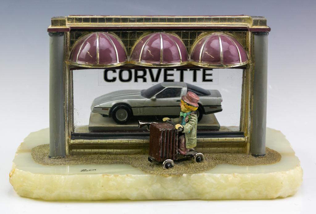Ron Lee Corvette Car Shop World Of Clown Figurine: Ron Lee (American,1947-2017) Musical clown, riding an accordion bike with horn, looking through a Corvette car shop window at Corvette sports car. From the "Greatest Clown Collectors Club". Featuring 