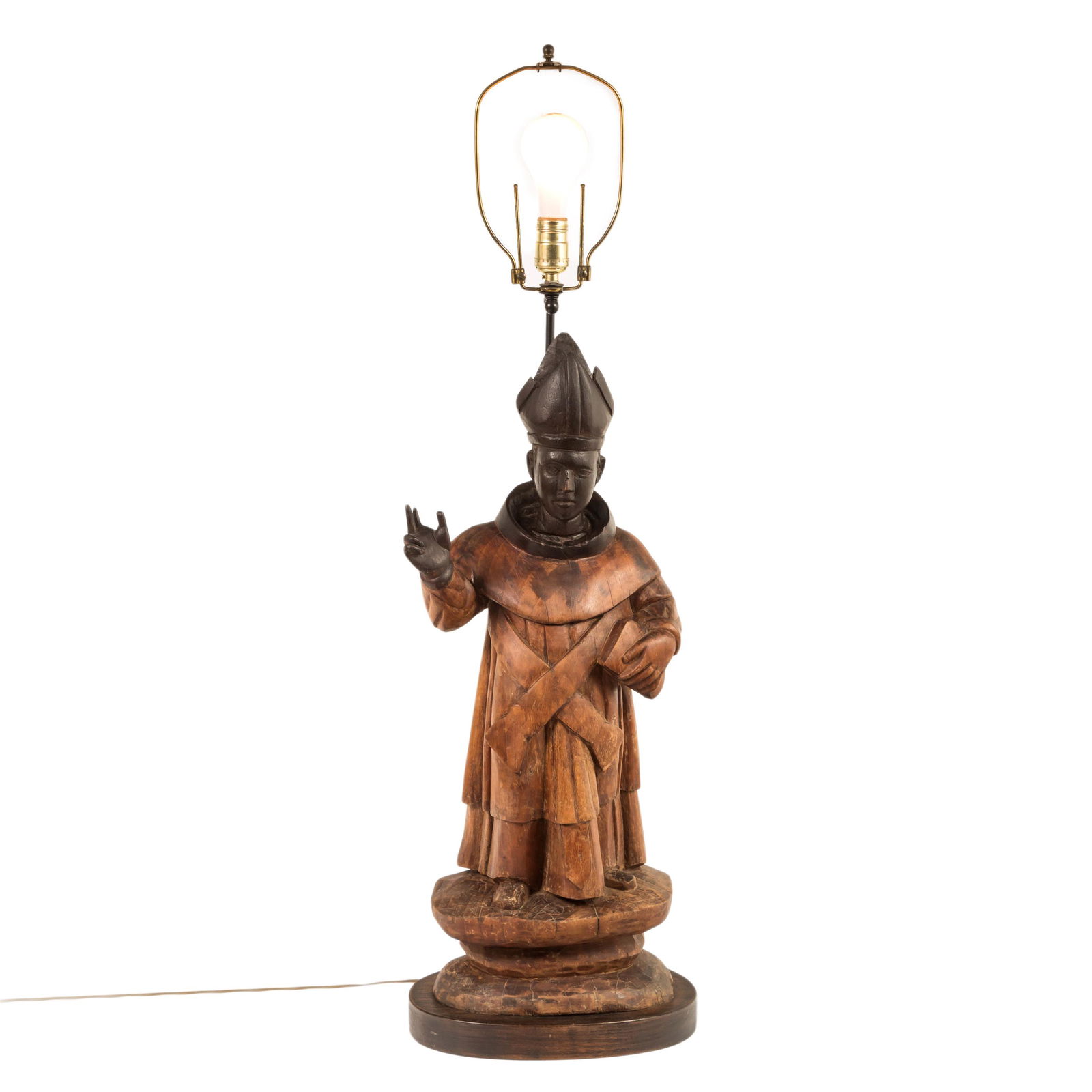 Latin American Wood 41" Bishop Pope Santos Statue: A large and impressive hand carved sculpture of a classic Bishop, Metropolitan, or Pope in two tone color wood, with right hand raised in the traditional gesture of papal benediction, a partially outs