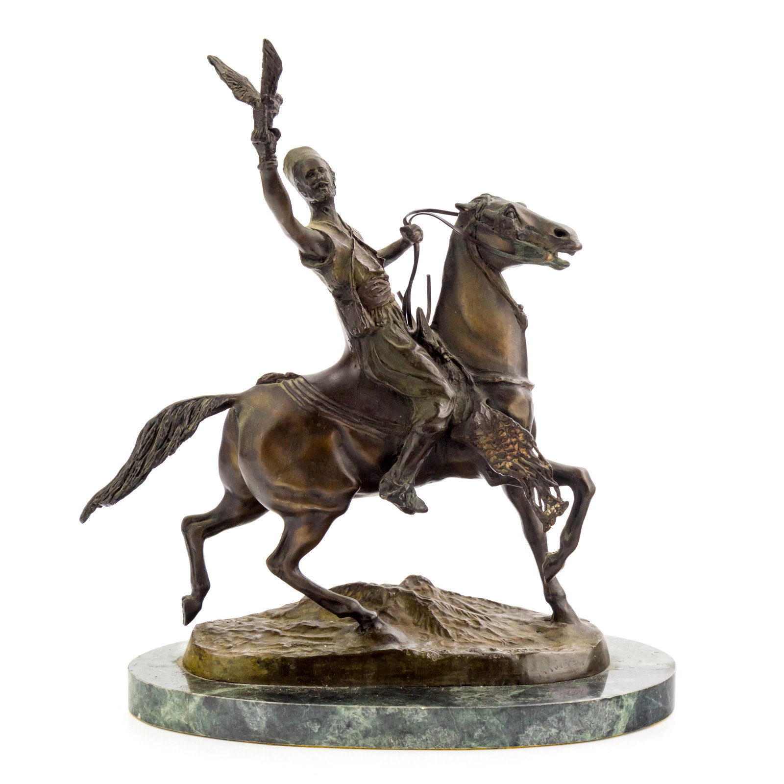 Late Victorian Orientalist Bronze Equine Sculpture: From a mystery artist, a fine old circa late 19th Century bronze sculpture featuring an Orientalist or Middle Eastern rider on a horse with hawk in one hand. Fixed to a green natural stone base. Measu