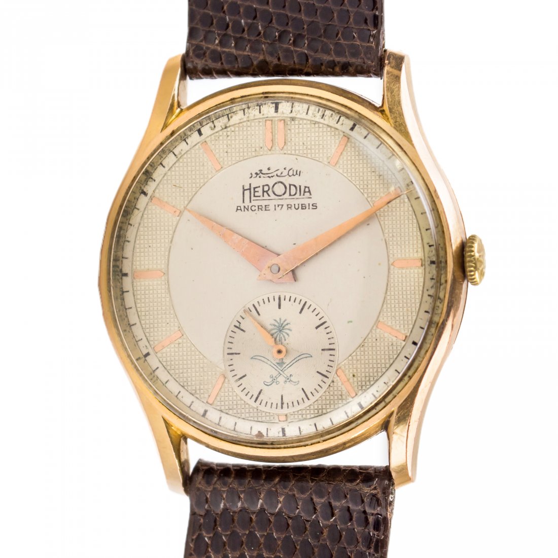 Saudi Arabian 18k Gold Herodia Working Mans Watch: Working men's watch from Saudi Arabia. Possibly a gift from an official. Features white dial with Royal Saudi crest and Arabic writing. The case measures 33mm and is crafted of 18k gold. It housed a w