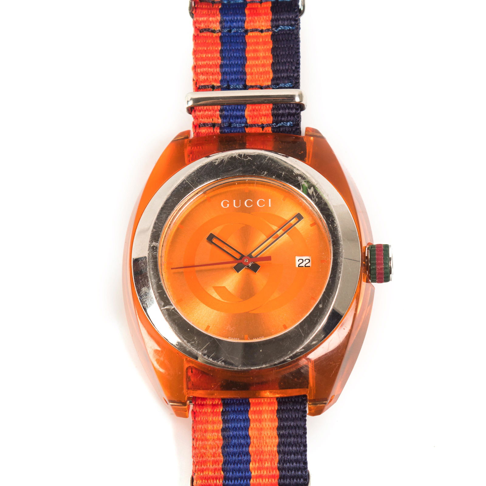 Vintage Gucci Orange Sync Unisex 45mm Date Watch: Vintage Gucci Sync watch. Features an orange acrylic case housing a working quartz movement. Replaced strap. Good overall condition with wear. Hill Auction Gallery in house USA continental Shipping $2