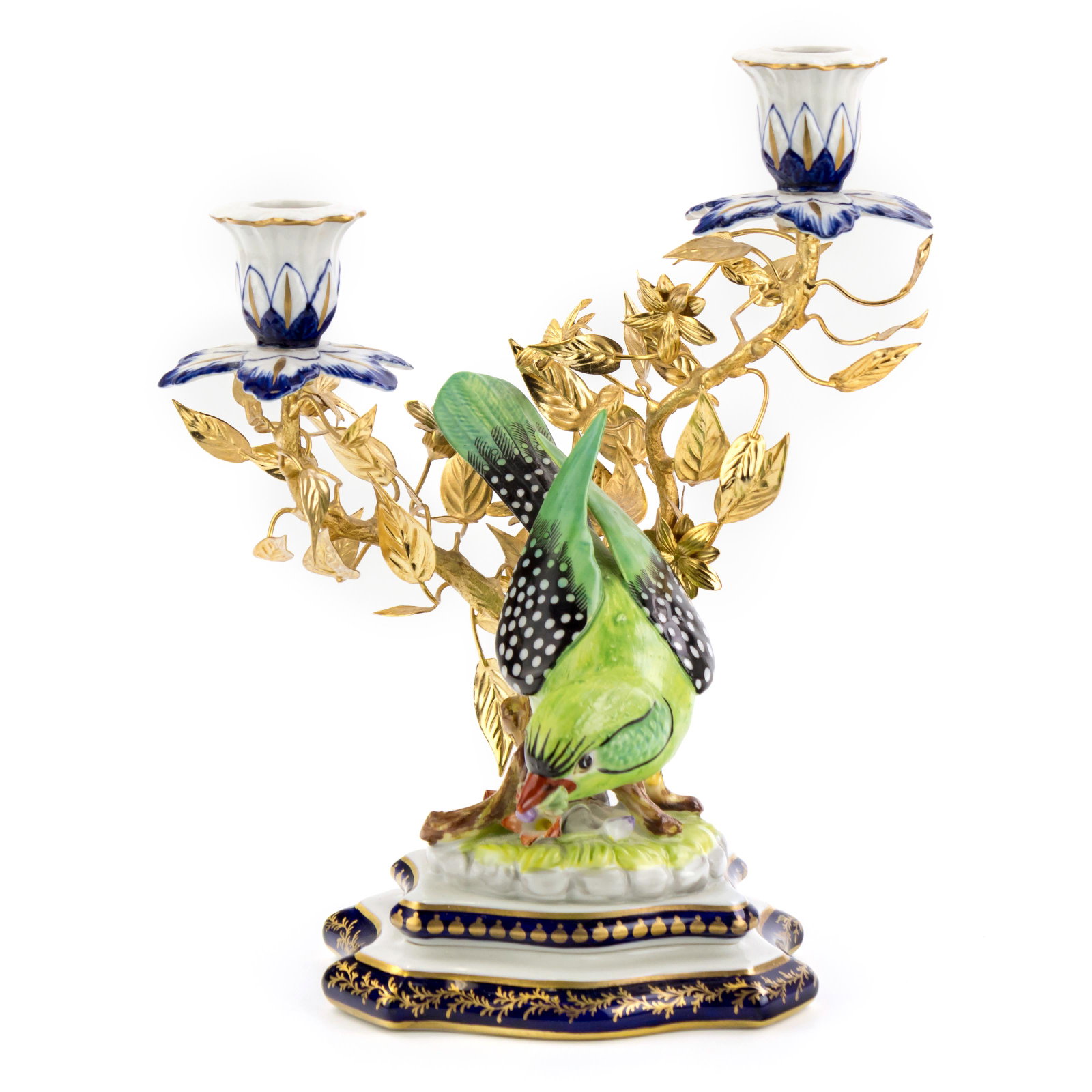 Sevres Style Porcelain Bird Dore Bronze Candelabra: Fine hand painted French porcelain and dore bronze candelabra featuring hand painted porcelain bird perched on porcelain base with applied leafy branches in gold finish. Signed on base. Measures 10 1/