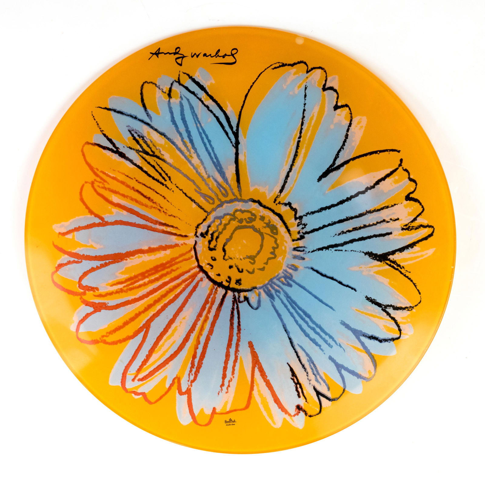 Andy Warhol 1928-1987 Rosenthal Charger Plate: Andy Warhol (American, 1928–1987). Signed 20th Century floral charger plate in colorful blue and red against an orange background. Signed ANDY WARHOL ROSENTHAL LINE STUDIO. Measures 13 1/4 in. acros