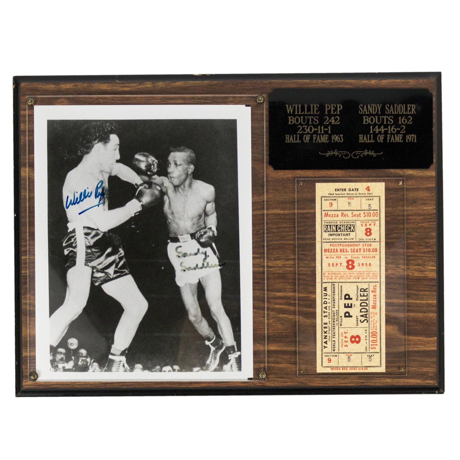 Willie Pep & Sandy Saddler SIGNED Boxing Photo: Mounted on a decorative wooden plaque. Commemorating the third match of a four bout series held in 1950 between the Hall of Fame world featherweight champions during which Saddler regained the crown. 