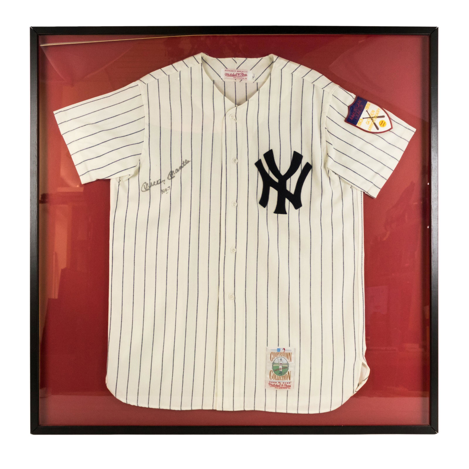 Mickey Mantle SIGNED New York Yankee Jersey Shirt: An original framed MLB Cooperstown Collection uniform jersey autographed by American Baseball Hall of Fame player Mickey Mantle (1931–1995), nicknamed "The Mick" and "The Commerce Comet," and widely