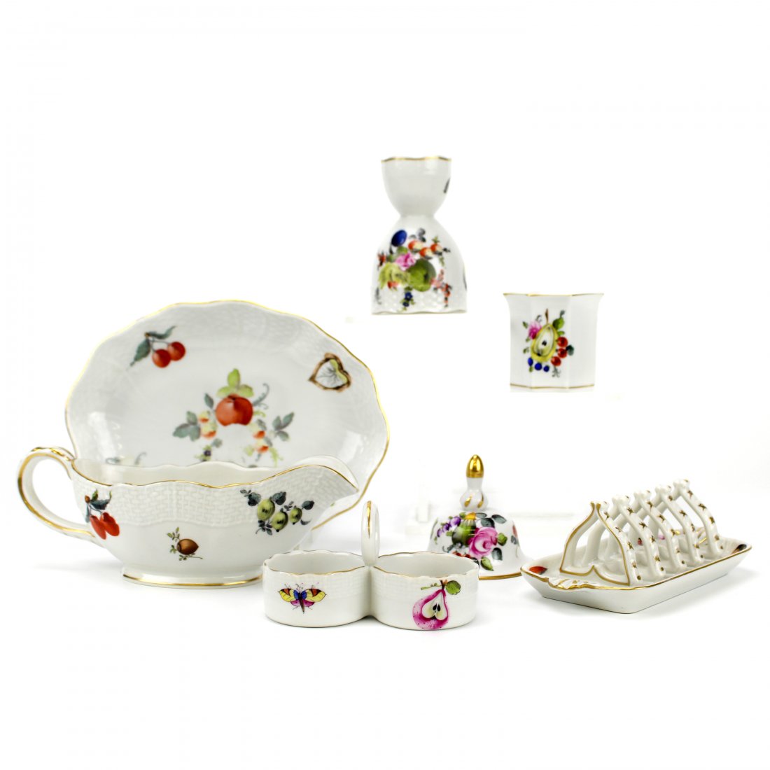 Herend Market Garden 7 Piece Table Accessories LOT: Herend (Hungarian). Seven pieces of fine quality porcelain in the Market Garden pattern with flora, fruit, mushrooms, and insect designs. Includes gravy boat, oval serving dish, egg cup, toothpick cup
