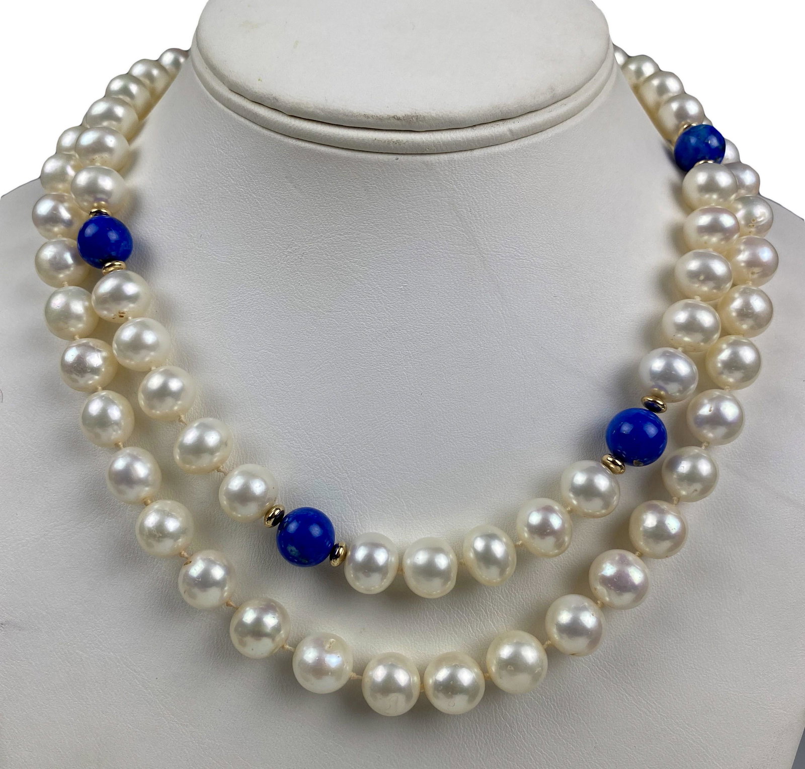 14k Gold Cultured Pearl Lapis Strand Necklace LOT: Two freshwater pearl necklaces, 10mm pearls strung with blue lapis lazuli and 14k gold beads, finished with 14k gold clasp. Each individually hand knotted on silk thread. Marked 14k. Measures 16 1/2 i