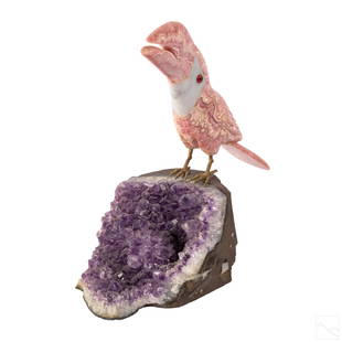 Rhodochrosite Toucan Bird & Raw Amethyst Sculpture: Hand carved pink rhodochrosite toucan bird sculpture, perched on raw amethyst. Features brass feet and glass eyes. Fair condition, with repairs and losses to feet and tail of bird. Measures 10 1/2