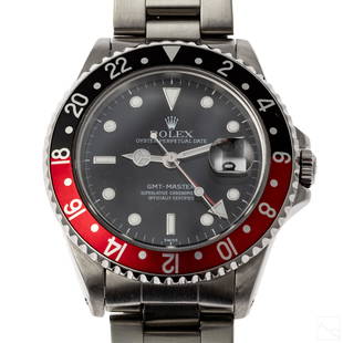 Rolex GMT Master Ref 16700 Red & Black Bezel Watch: Rolex (Swiss). Men's vintage sport model GMT Master watch. Ref 16700 automatic mechanical movement housed in a stainless steel case. Stainless steel Oyster bracelet with deployment closure. Dial is