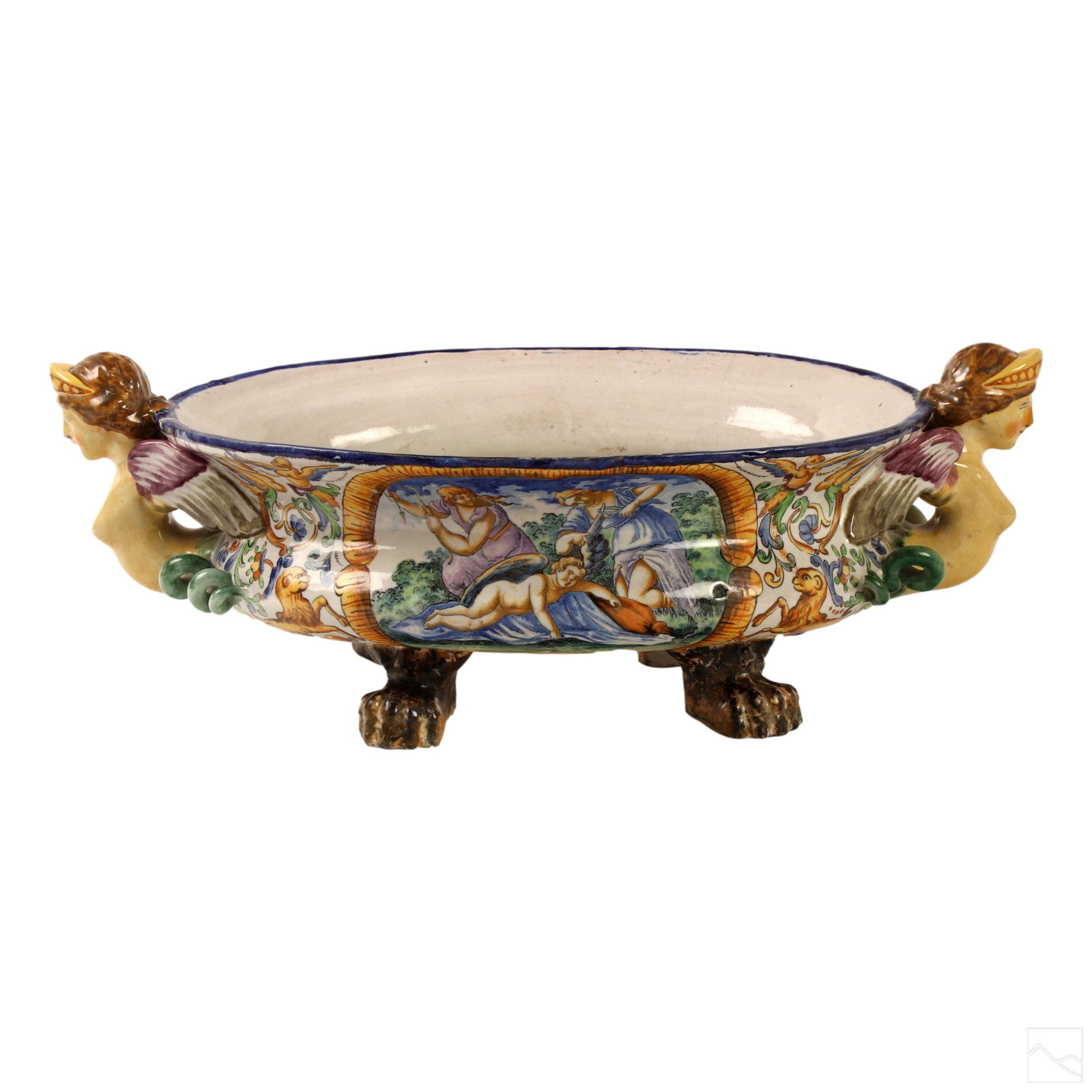 Italian Faience Majolica Antique Footed Jardiniere: Crafted of fine quality Italian art pottery. Features a stunning Renaissance Revival design with winged female nude double handles, oblong shape and lion paw feet. Hand painted scenic decoration with 