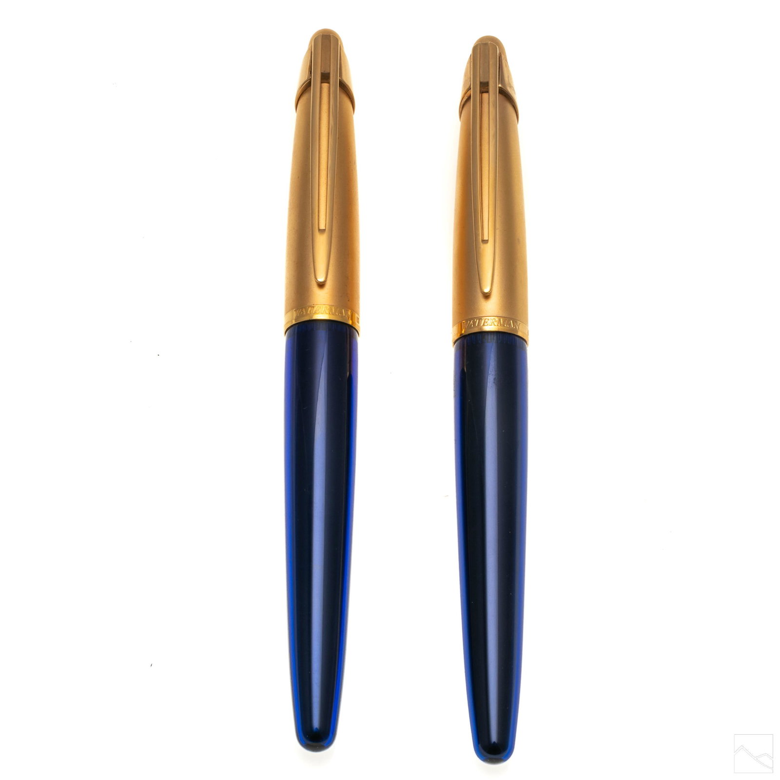 Waterman 18K Gold Nib Fountain and Ballpoint Pens: Lot of two Waterman pens. One 18k nib fountain pen and one ballpoint pen. Both with frosted golden caps and blue acrylic bodies. Marked Waterman 18k on the fountain pen and Waterman on the ballpoint p