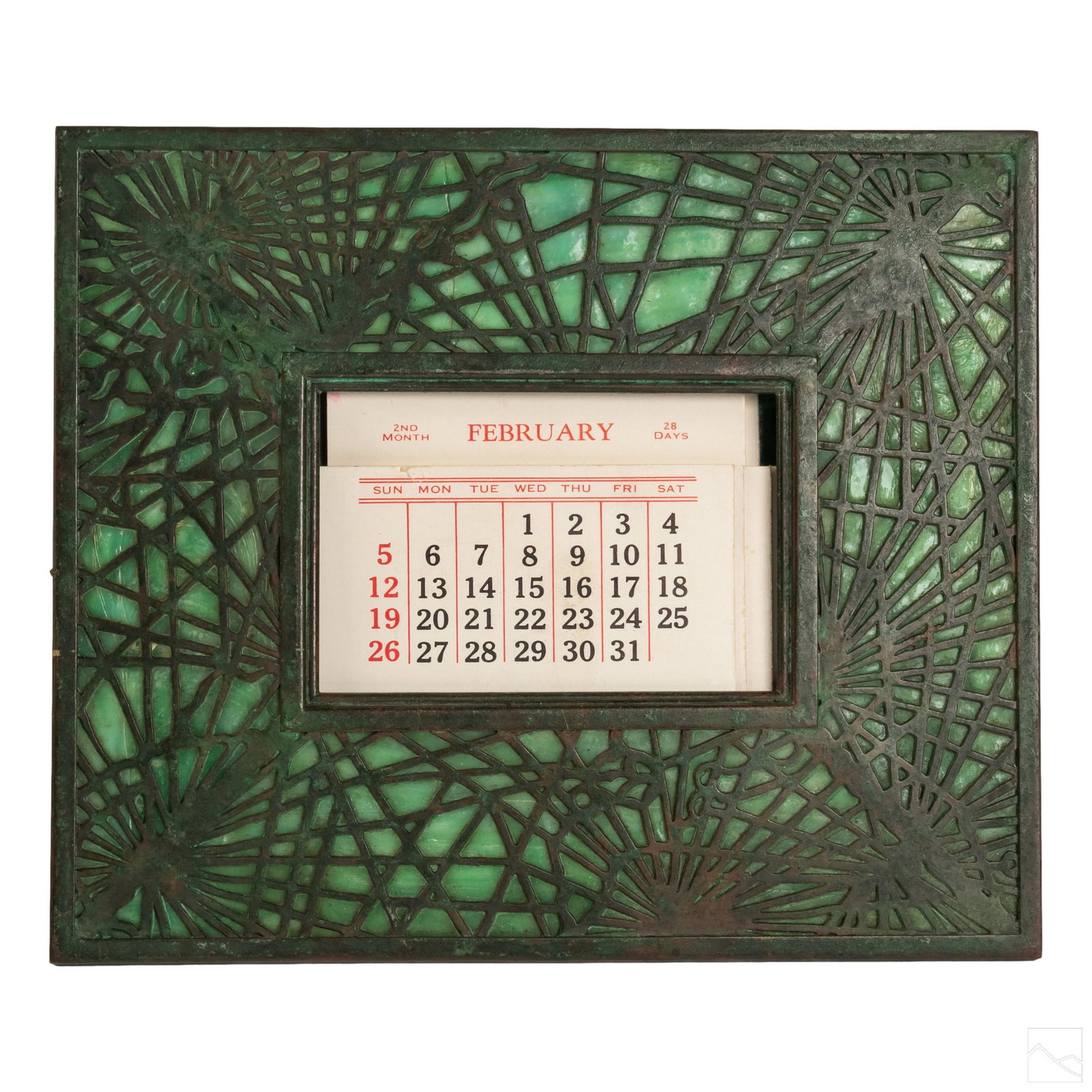 Tiffany Studios Art Nouveau Bronze and Glass Frame: Tiffany Studios Art Nouveau "Pine Needle" pattern easel style frame. Features bronze over green slag glass. Signed Tiffany Studios New York #940. Glass is cracked on top panel of frame. Measures 6 in.