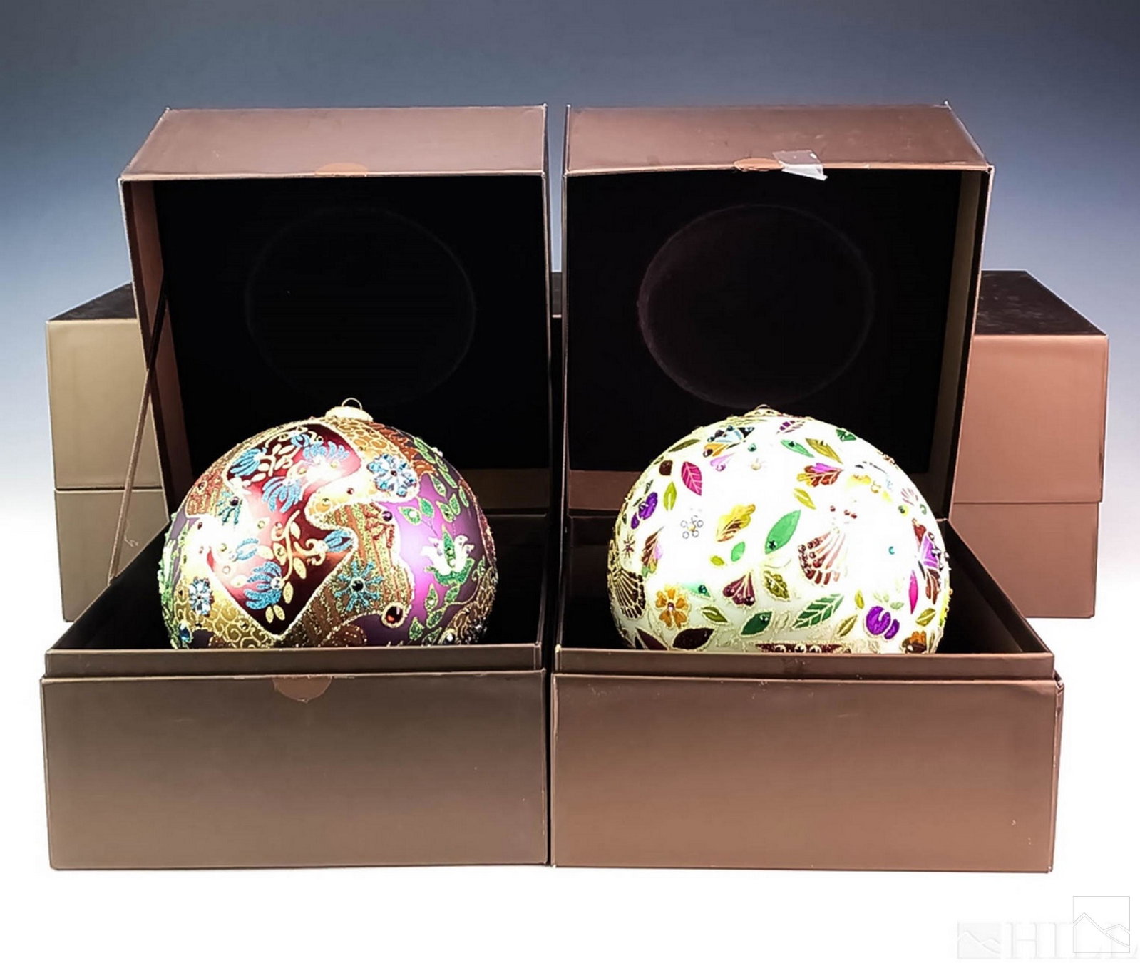Jay Strongwater Glass Christmas Ornaments Group: Set of five Jay Strongwater art glass Christmas ornaments. Hand painted design, embellished with Swarovski crystal. Three multi-colored ornaments celebrating Christmas 2016. Two white ornaments decora